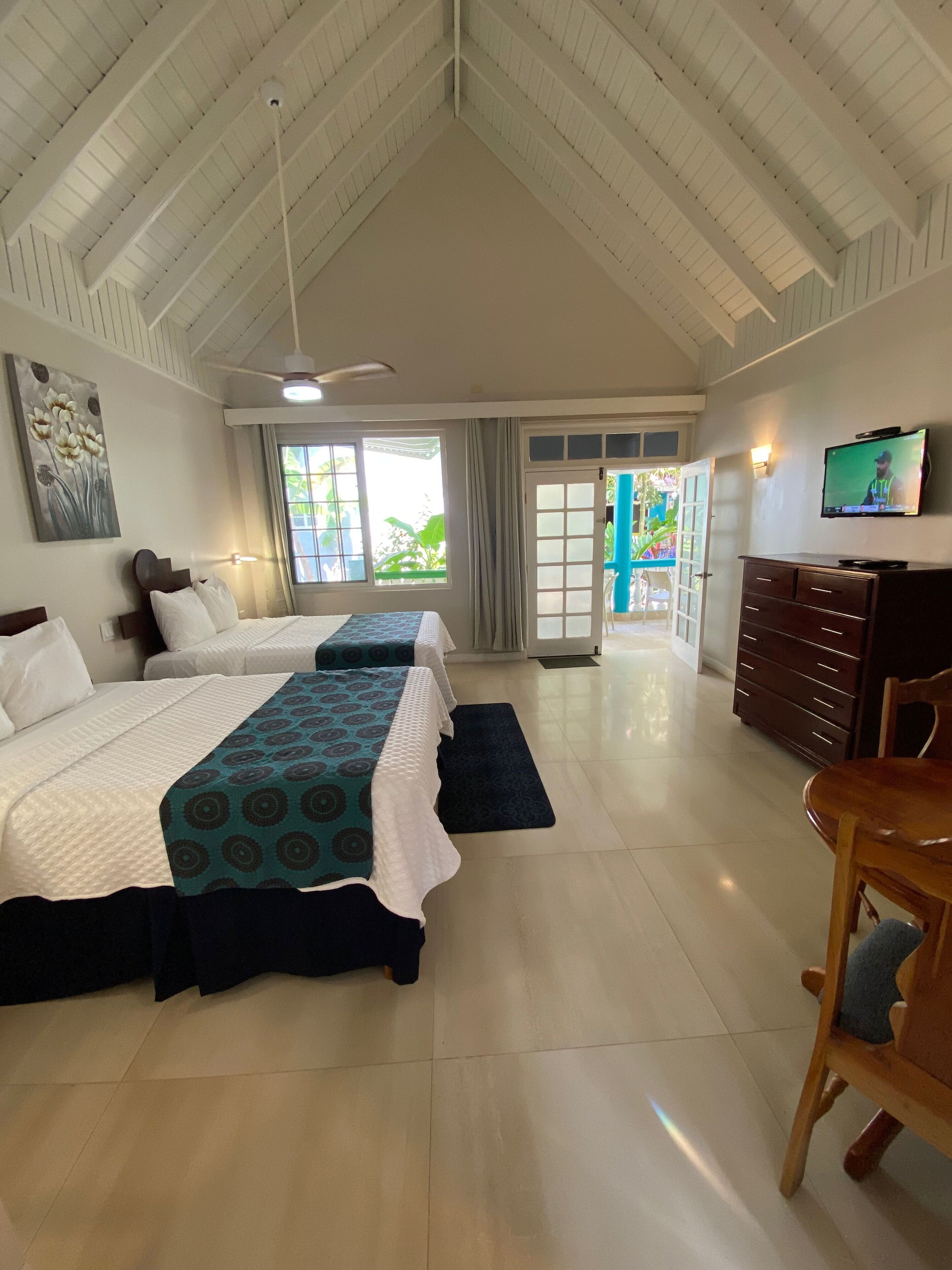 standard room, 2 double beds, beachside | living area | 32-inch tv with premium tv channels