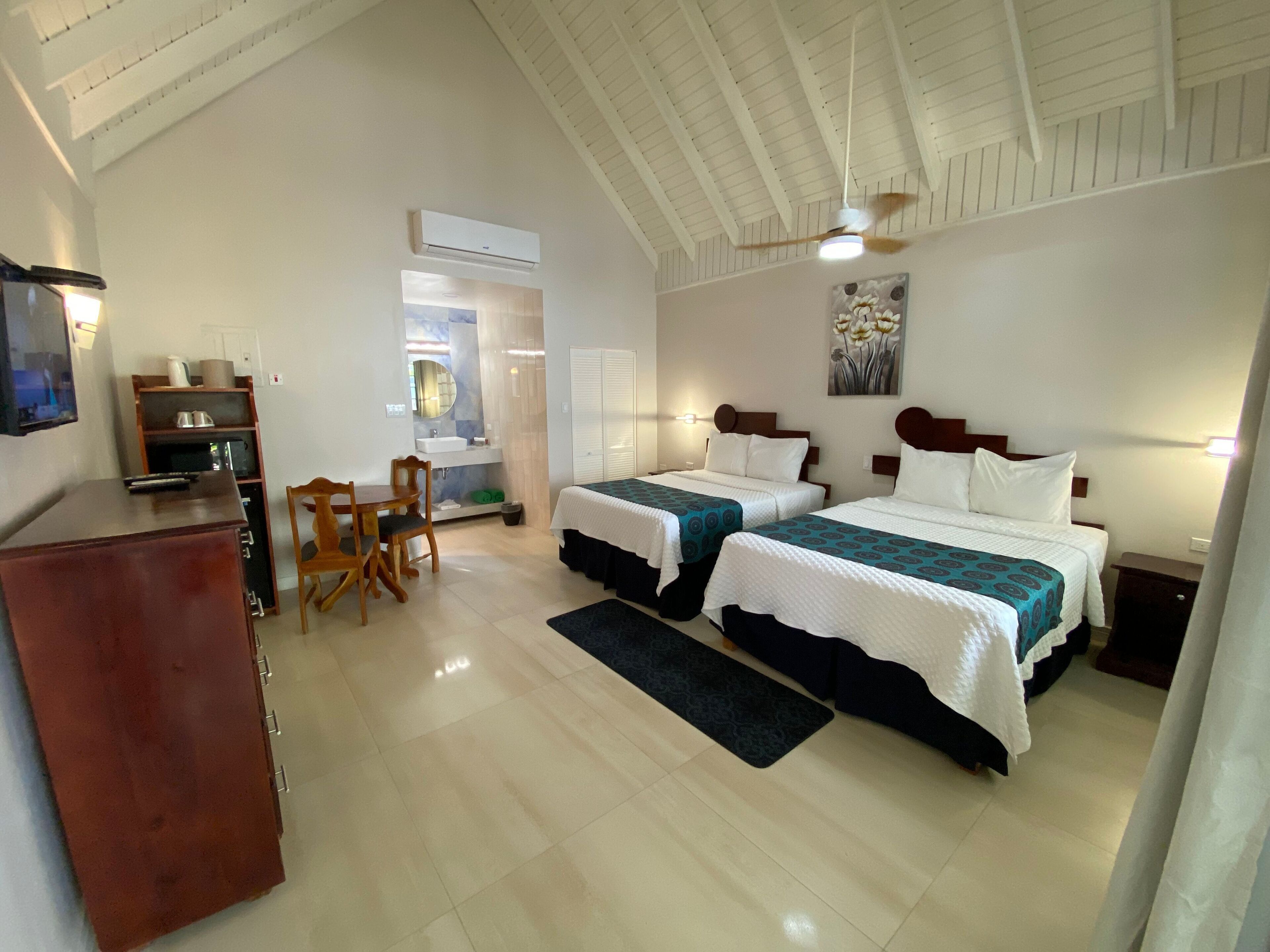 standard room, 2 double beds, beachside | living area | 32-inch tv with premium tv channels