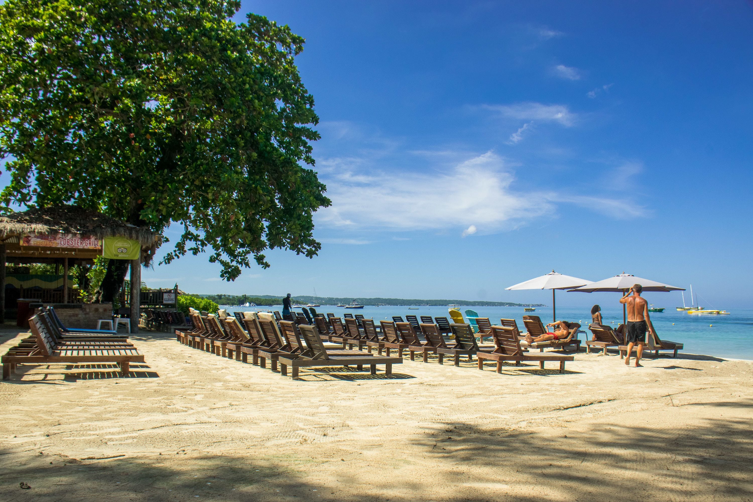 private beach, white sand, beach shuttle, beach cabanas