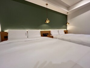 Family Quadruple Room, 2 Queen Beds | Down comforters, free minibar, desk, blackout drapes