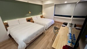 A hotel room with two beds, a desk with a chair, and a large window. - Fooyee Hotel Wenxinzq (Taichung)