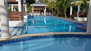 Outdoor pool, open 8:00 AM to 7:00 PM, sun loungers