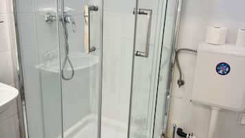 Shower, rainfall showerhead, hair dryer, towels
