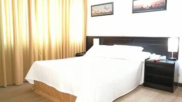 Habitación ejecutiva | Ropa de cama de alta calidad y minibar
