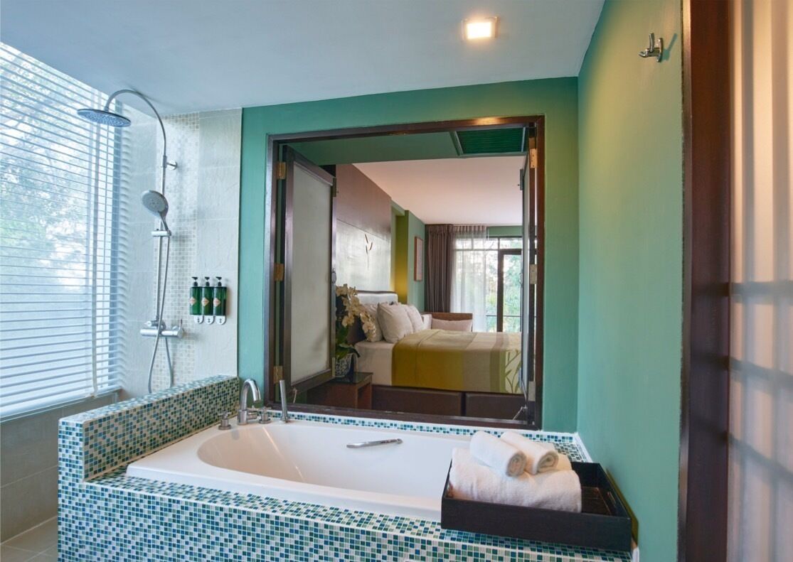 suite, 1 king bed, balcony, garden view | bathroom | separate bathtub and shower, free toiletries, hair dryer, slippers