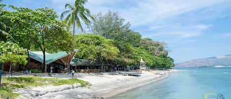 On the beach, white sand, beach volleyball, beach bar