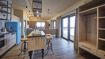 Penthouse mit Sonnenterrasse und Aussensauna | Zona de estar | Una televisión de pantalla plana