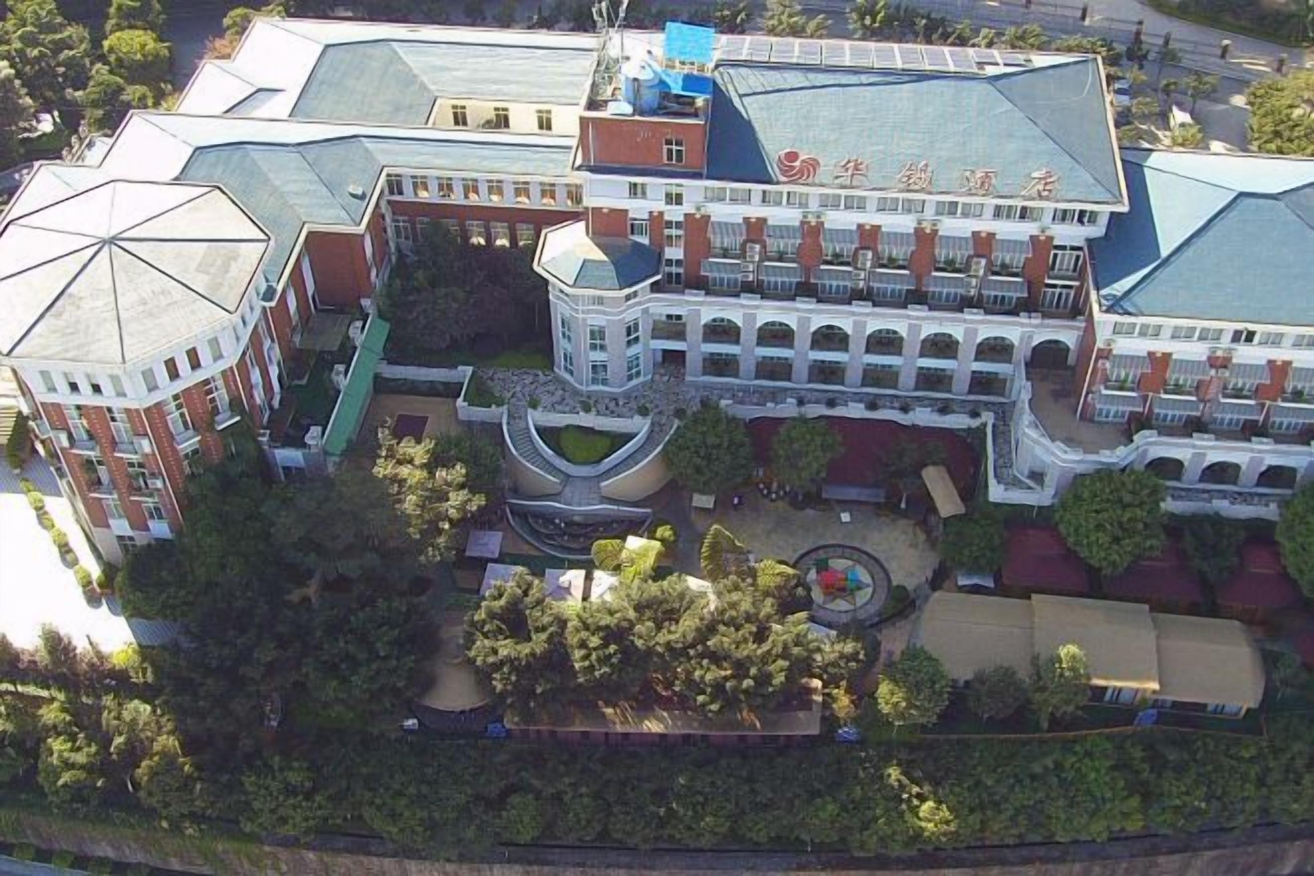 A large building with multiple wings and a central courtyard.