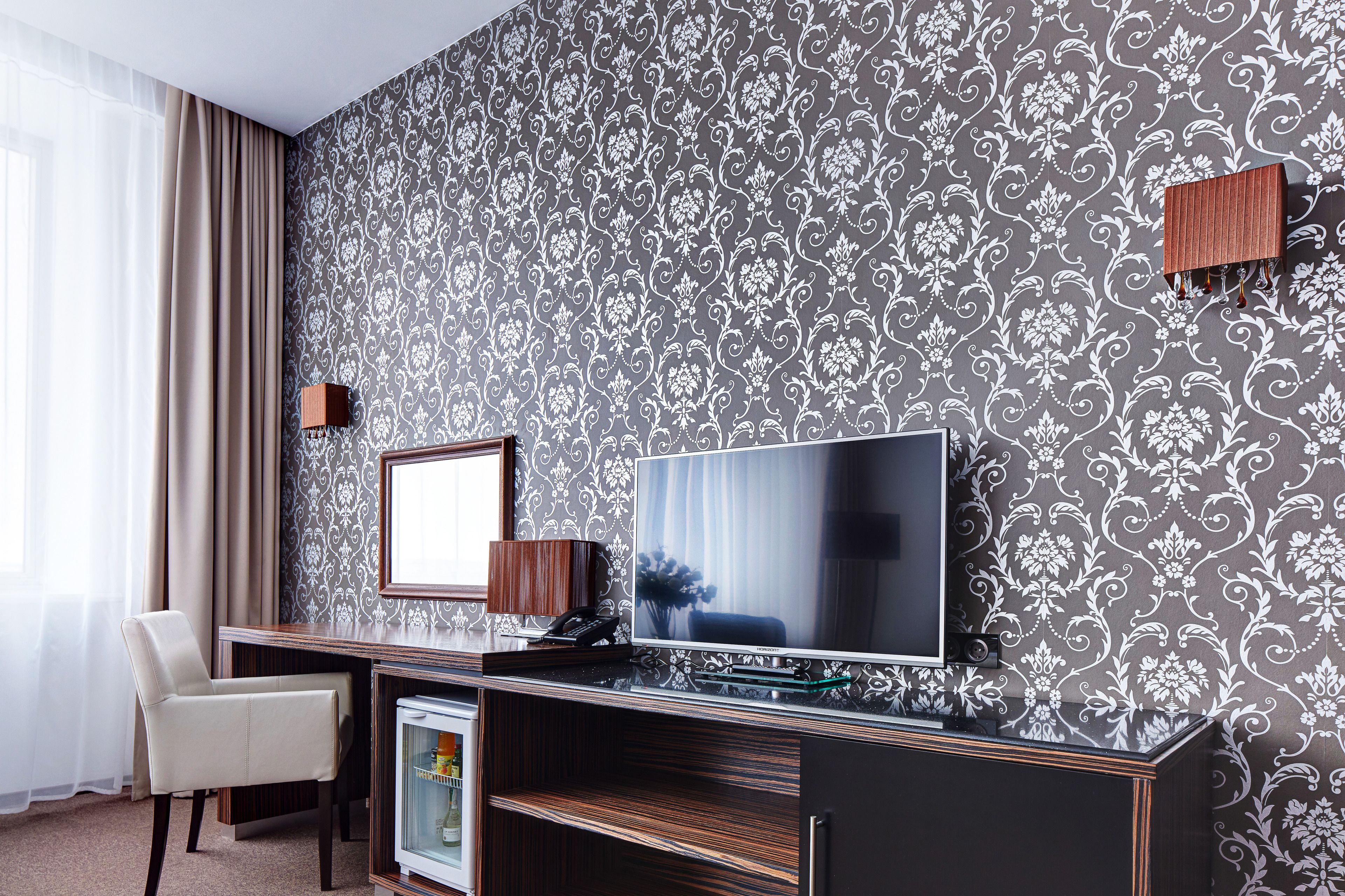 superior double room | living area | tv