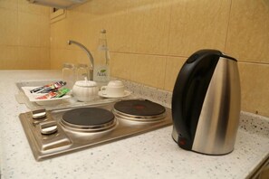 Fridge, microwave, stovetop, coffee/tea maker