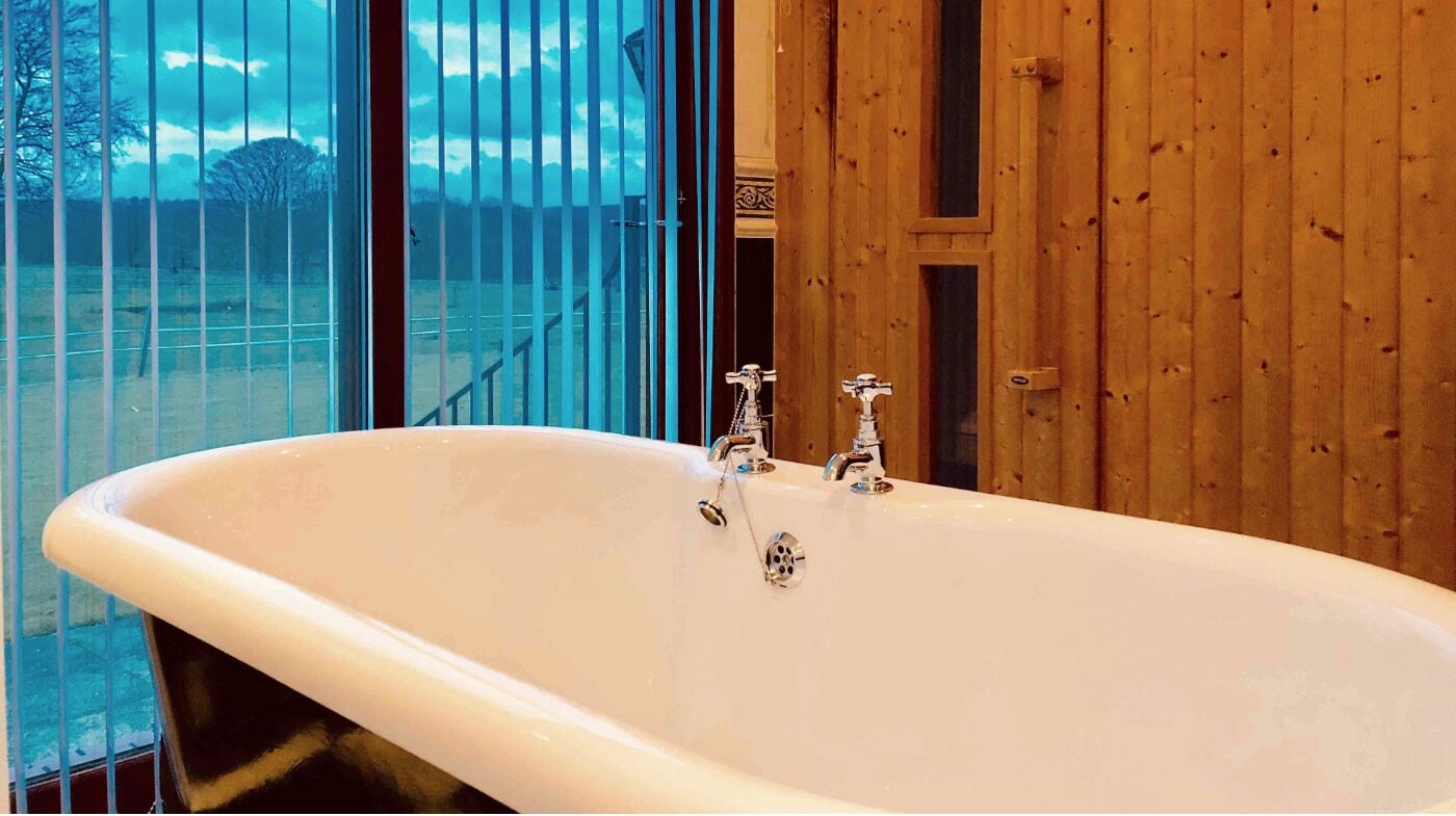 hair dryer, bathrobes, towels, toilet paper