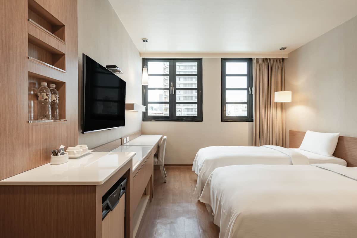 business twin room, 2 single beds | 1 bedroom, down duvets, desk, blackout curtains