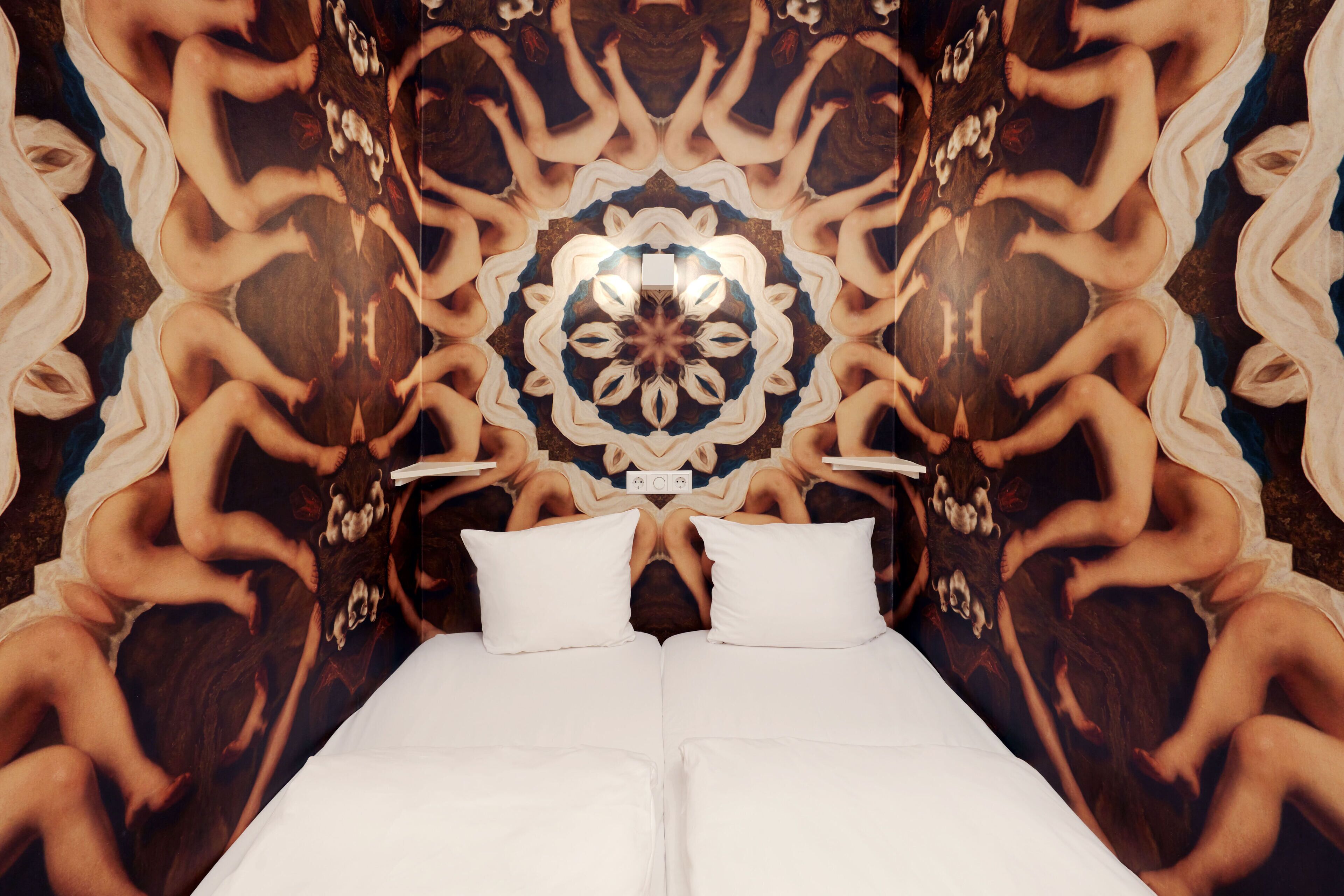 A symmetrical, mirrored room design with a central circular pattern and two beds aligned at the bottom.