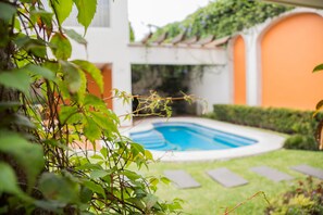 Outdoor pool, open 9:00 AM to 9:00 PM, sun loungers