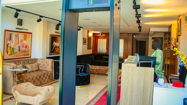 A hotel lobby with a reception desk, plush seating, and artwork on the walls. - Hôtel Belle Vue & Spa (Meknes)