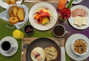 Enjoy a hearty breakfast with a selection of fresh fruits, meats, and pastries.