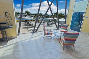 Enjoy a view of the outdoor pool area from the comfort of your room.