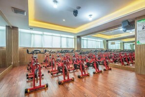 A gym with multiple exercise bikes arranged in rows. - Prestton Hotel (Jinan)