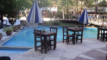 Indoor pool, outdoor pool, pool umbrellas, pool loungers