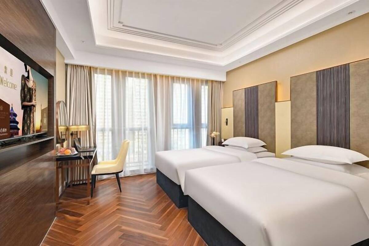 In-room safe, desk, laptop workspace, bed sheets