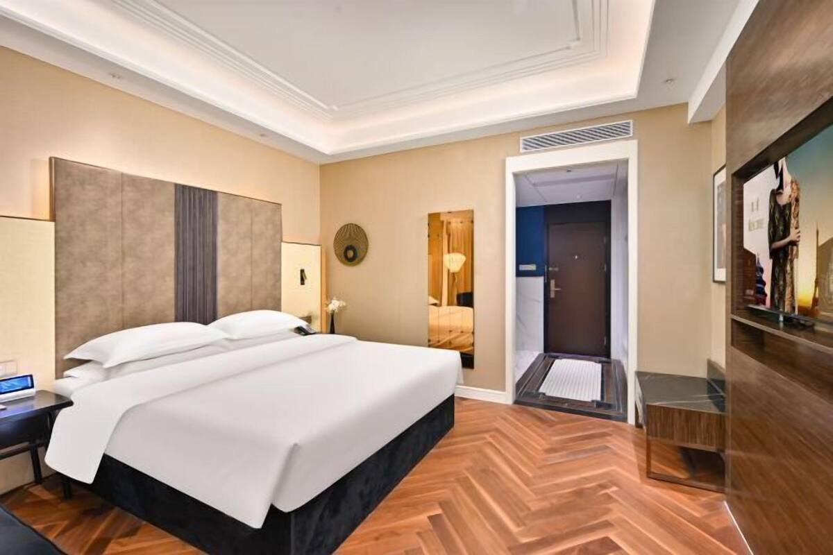 In-room safe, desk, laptop workspace, bed sheets