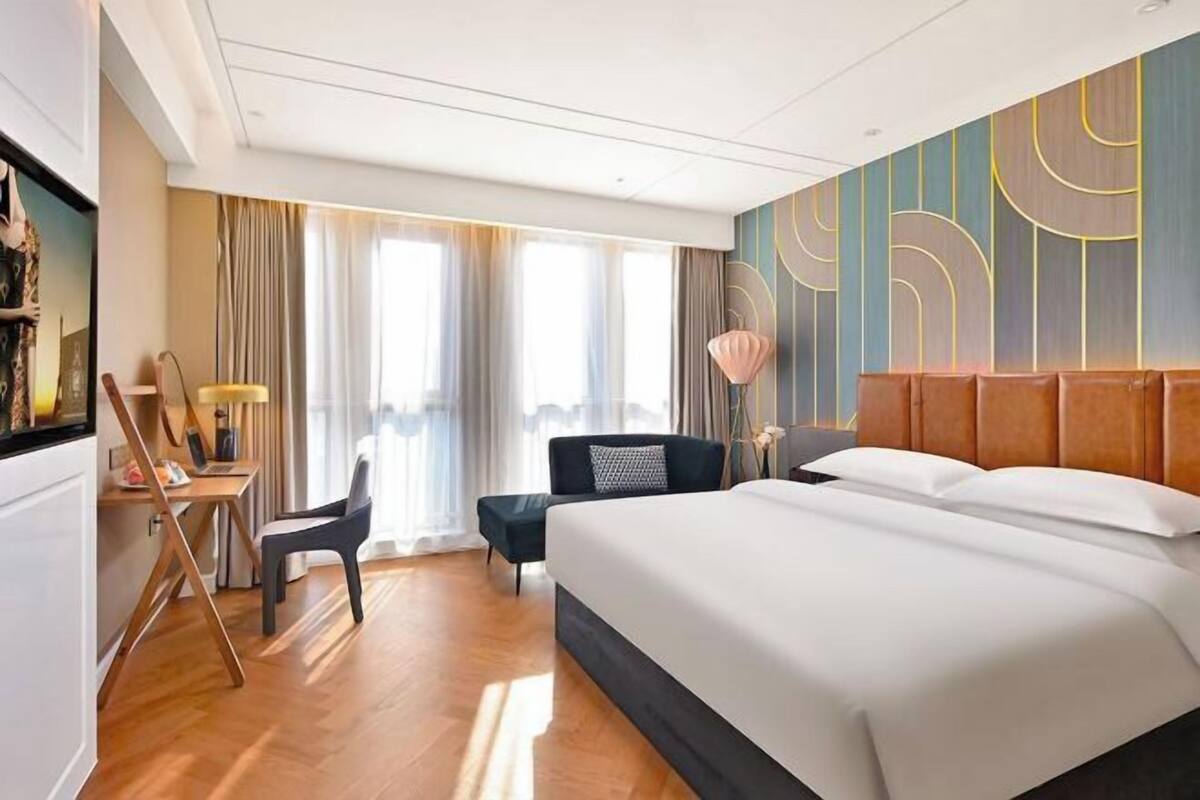 In-room safe, desk, laptop workspace, bed sheets