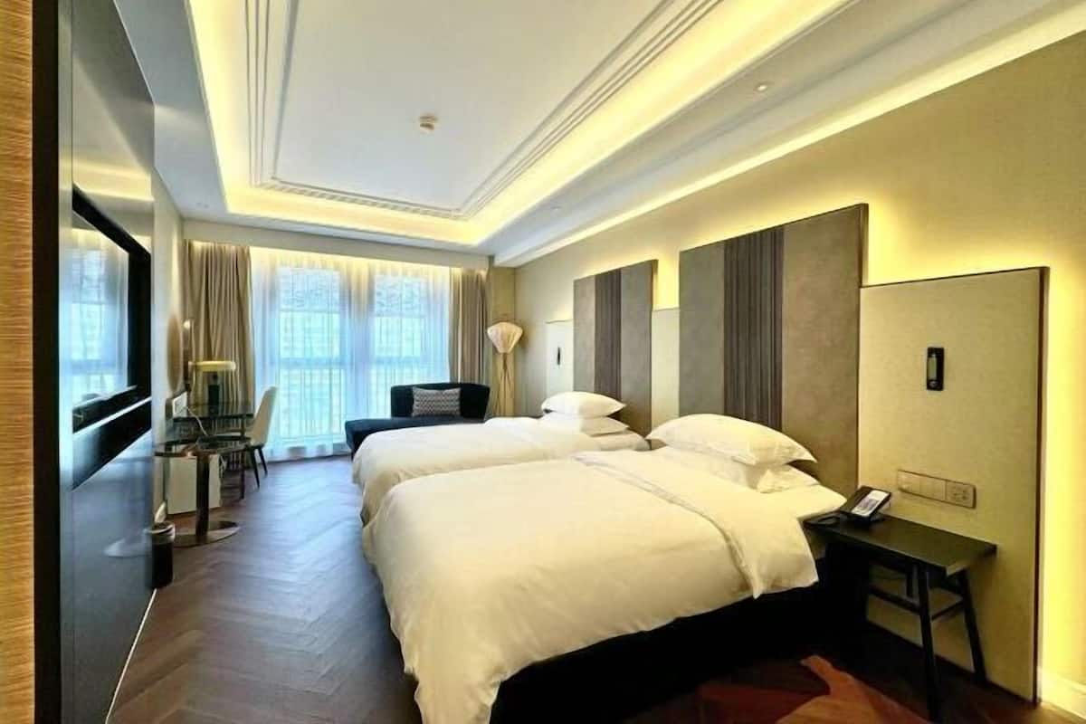 In-room safe, desk, laptop workspace, bed sheets