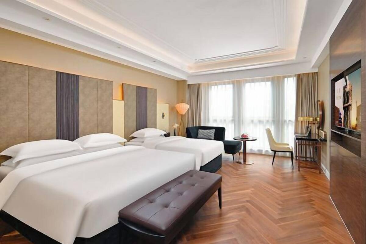 In-room safe, desk, laptop workspace, bed sheets