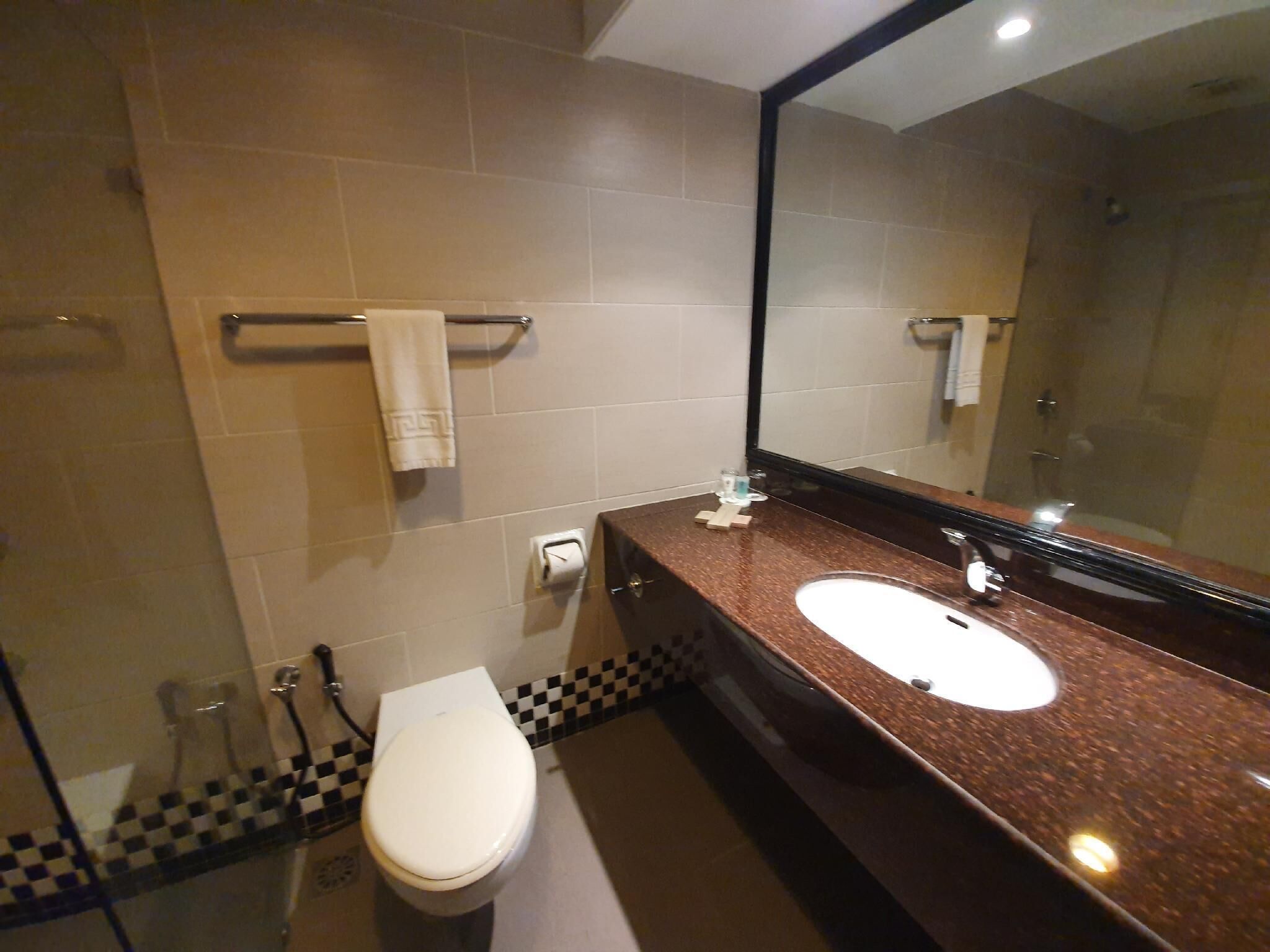 superior room, 1 king bed | bathroom | free toiletries, hair dryer, slippers, towels