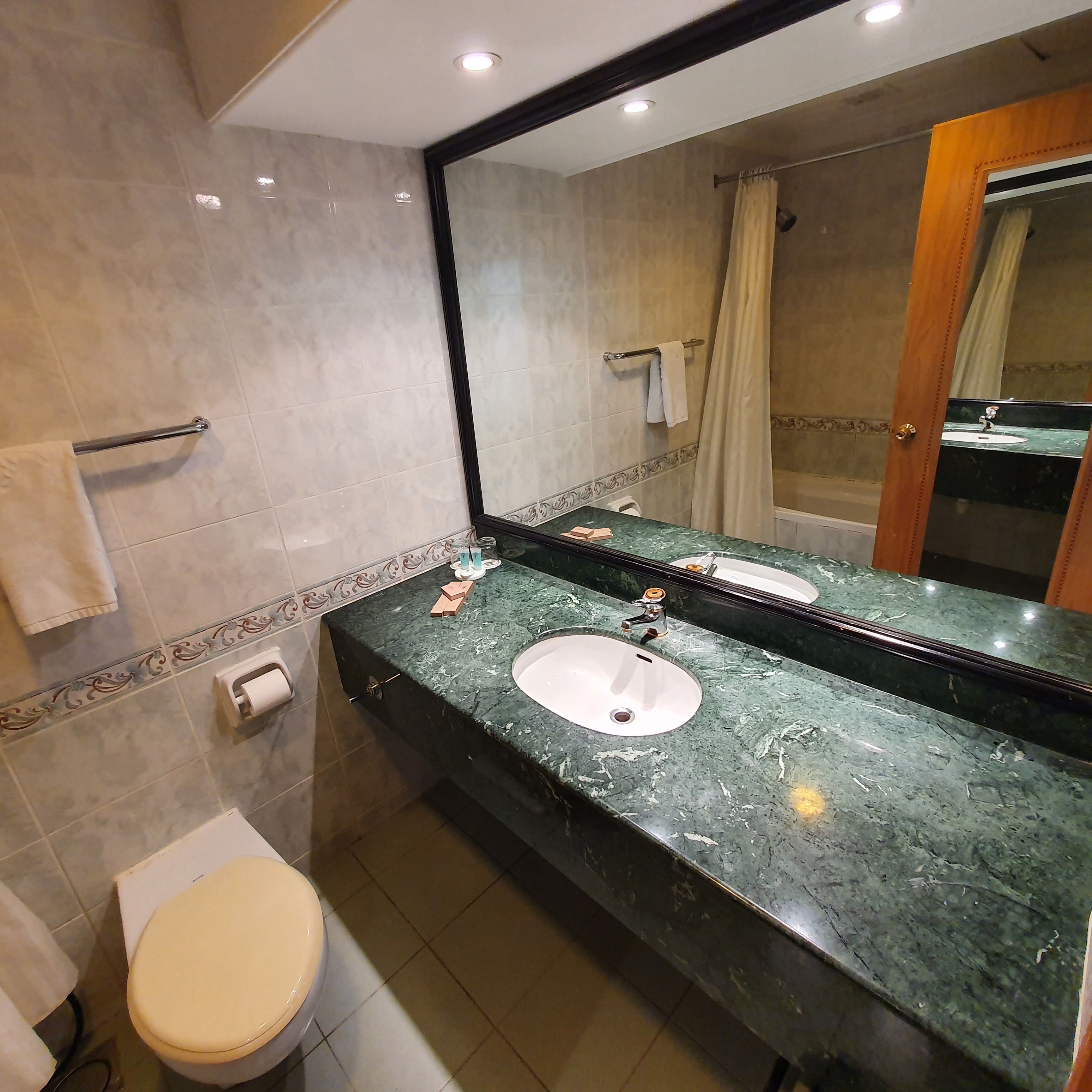 superior twin room | bathroom | free toiletries, hair dryer, slippers, towels