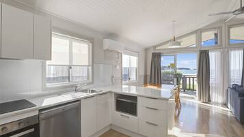 Beachside Spa Cabin (Sleeps 4) | Private kitchen | Fridge, microwave, stovetop, coffee/tea maker