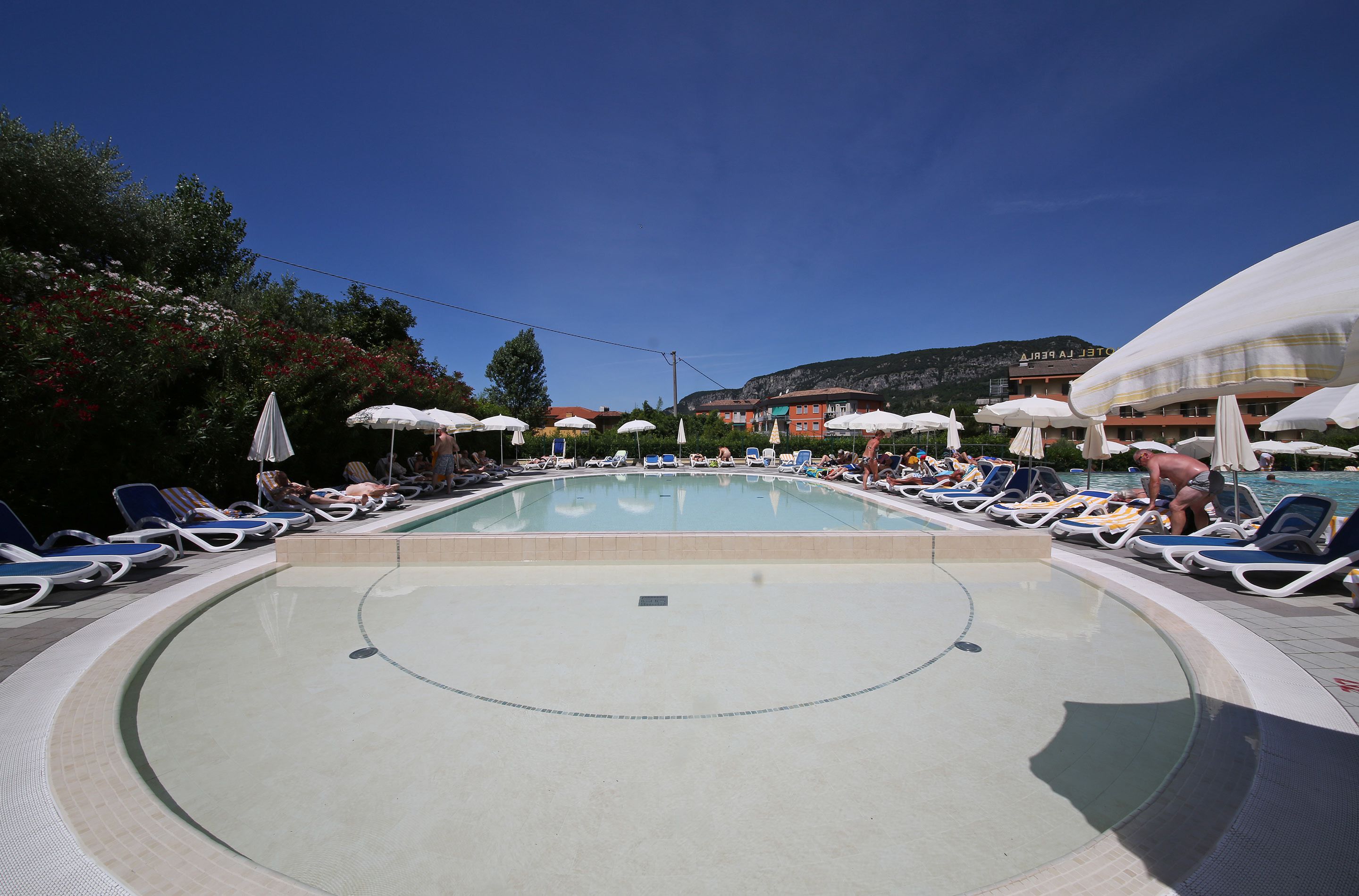 outdoor pool, pool umbrellas, pool loungers
