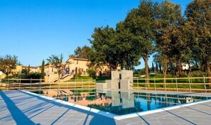 Seasonal outdoor pool, pool umbrellas, pool loungers
