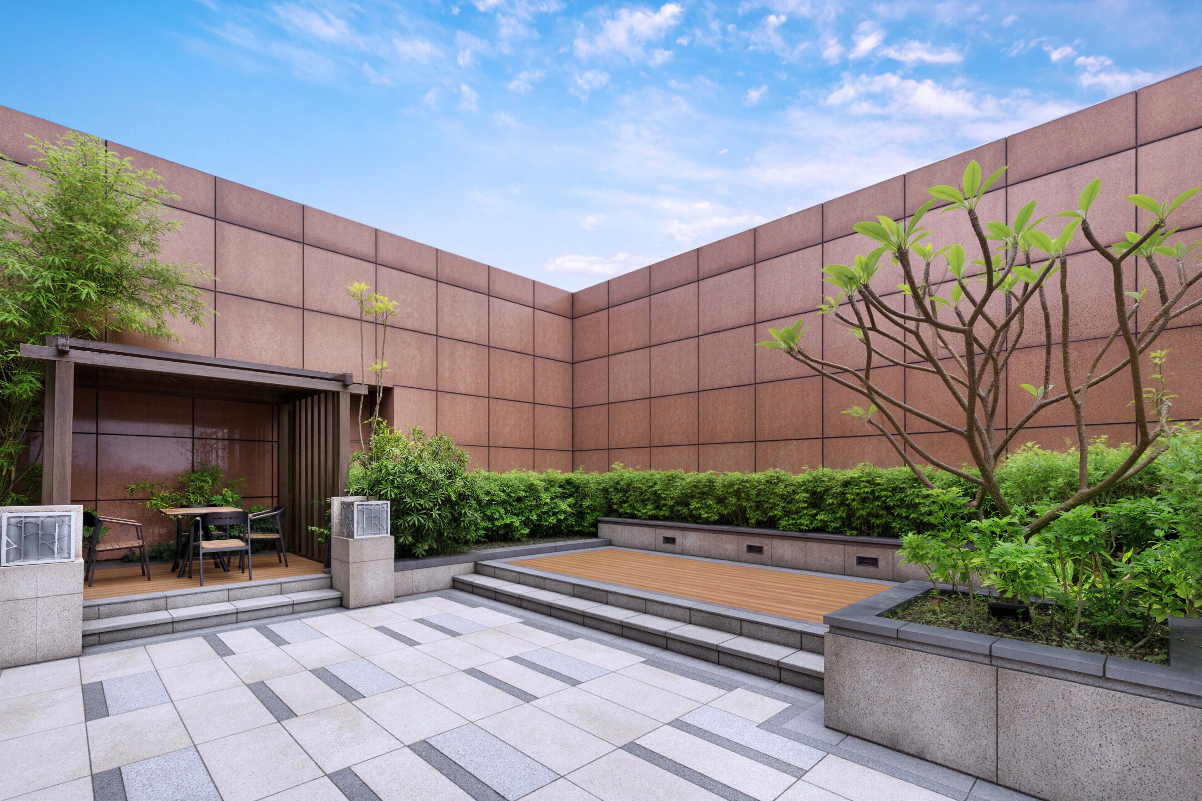 A modern courtyard with a wooden deck, seating area, and greenery.