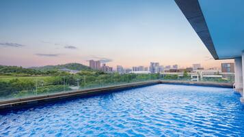 Outdoor pool, open 9:00 AM to 10:00 PM, pool loungers