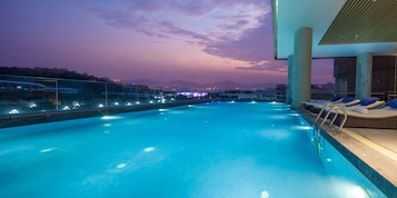 Outdoor pool, open 9:00 AM to 10:00 PM, sun loungers