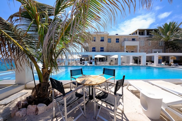 Outdoor pool, open 8 AM to 11:00 PM, free pool cabanas, pool umbrellas