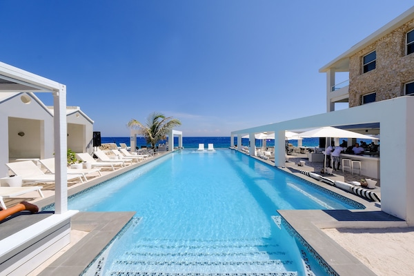 Outdoor pool, open 8 AM to 11:00 PM, free pool cabanas, pool umbrellas