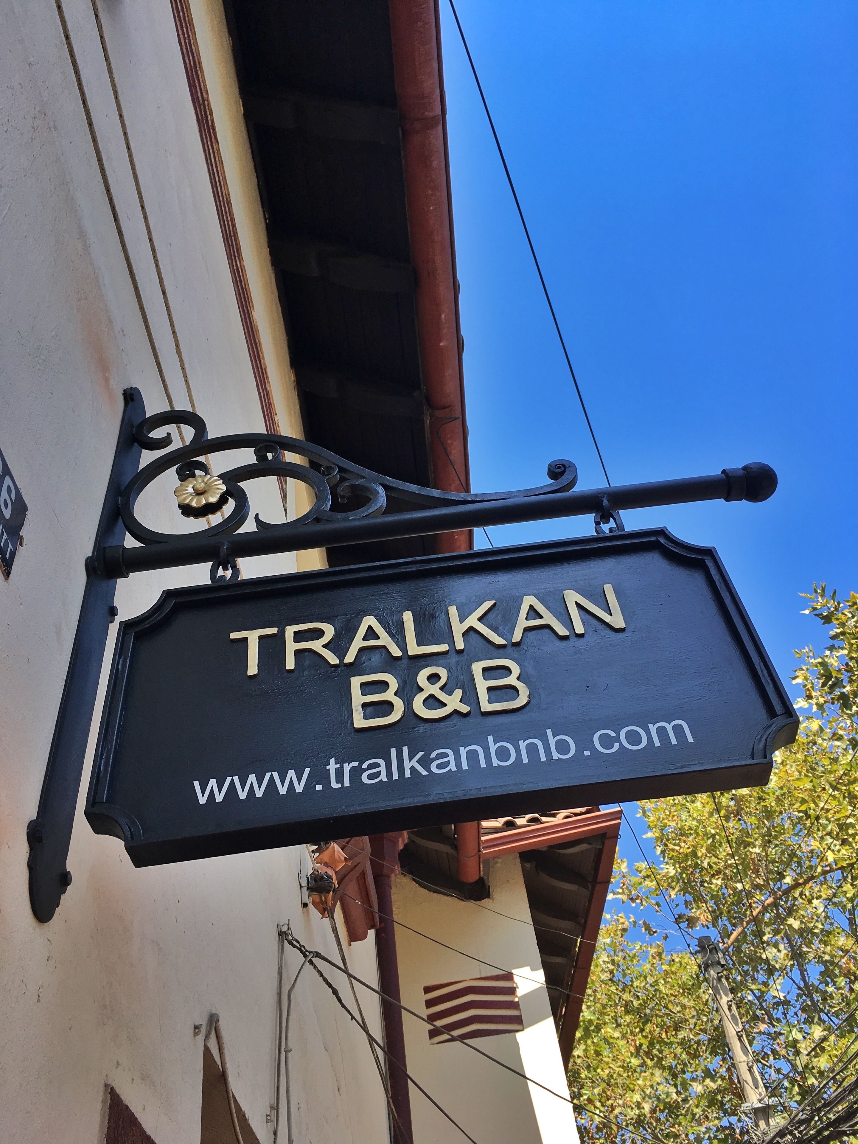A sign for 'TRALKAN B&B' with a website address.