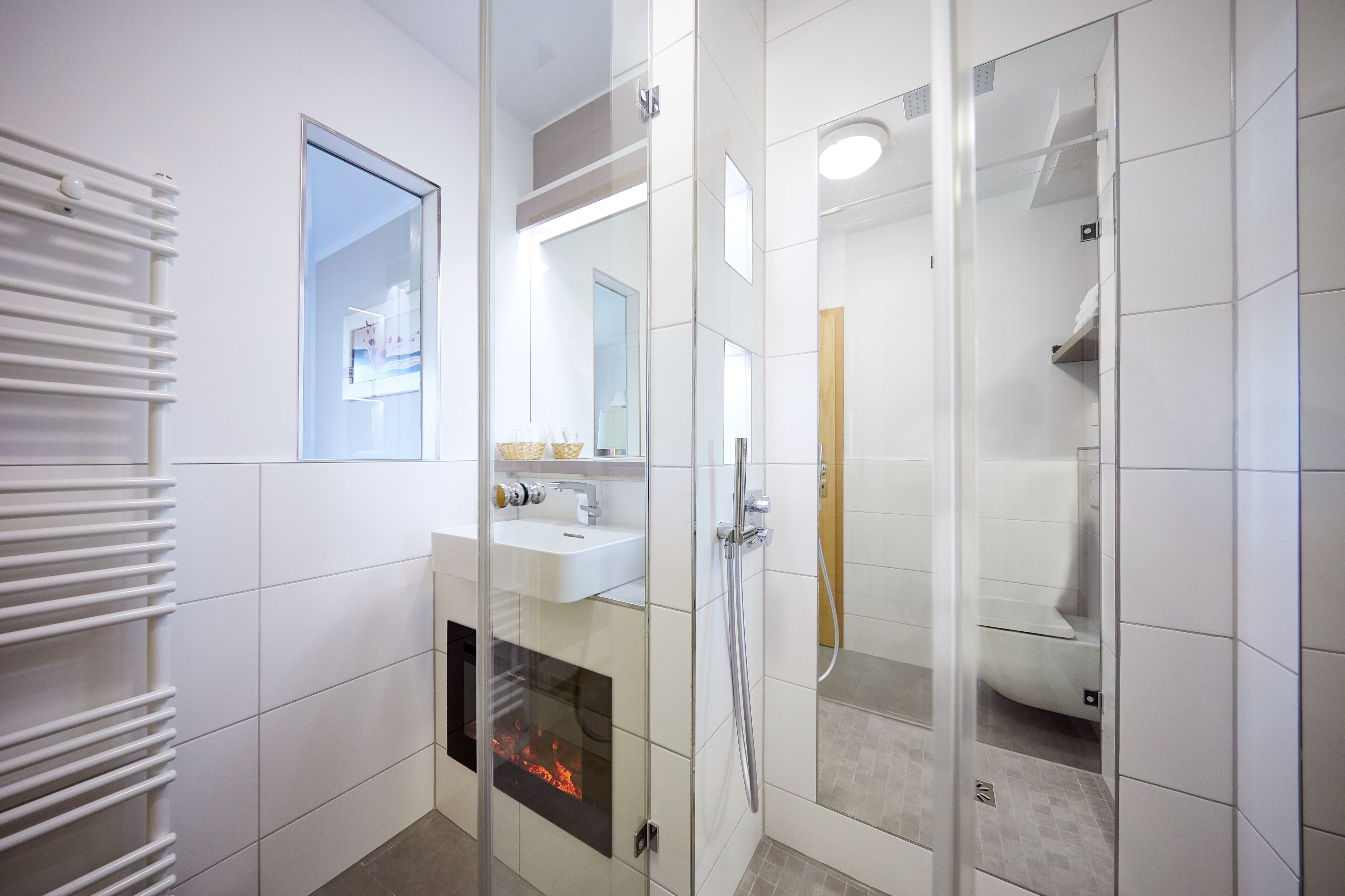 exclusive single room, 1 single bed, fireplace | bathroom | eco-friendly toiletries, hair dryer, slippers, towels