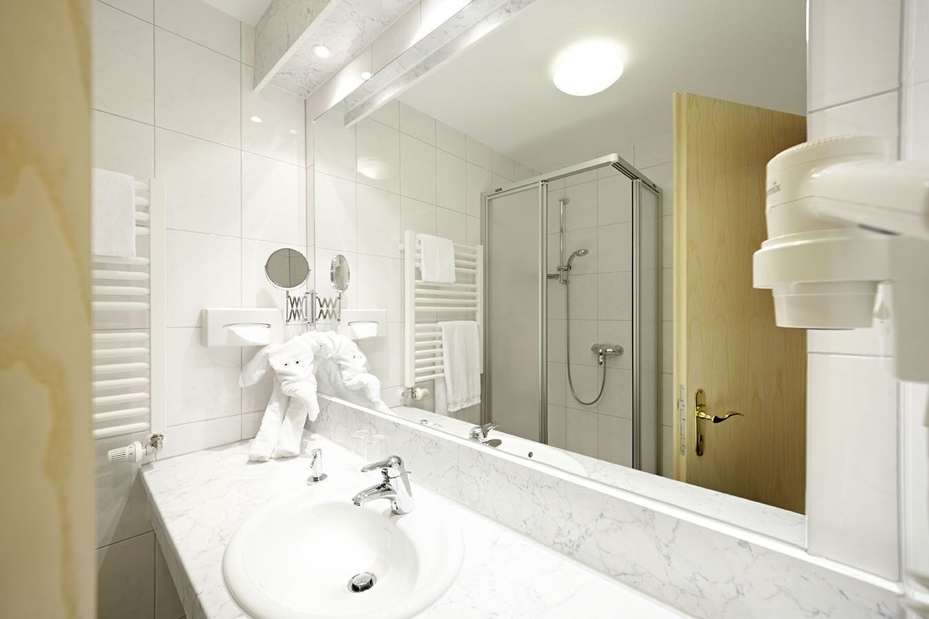 eco-friendly toiletries, hair dryer, slippers, towels