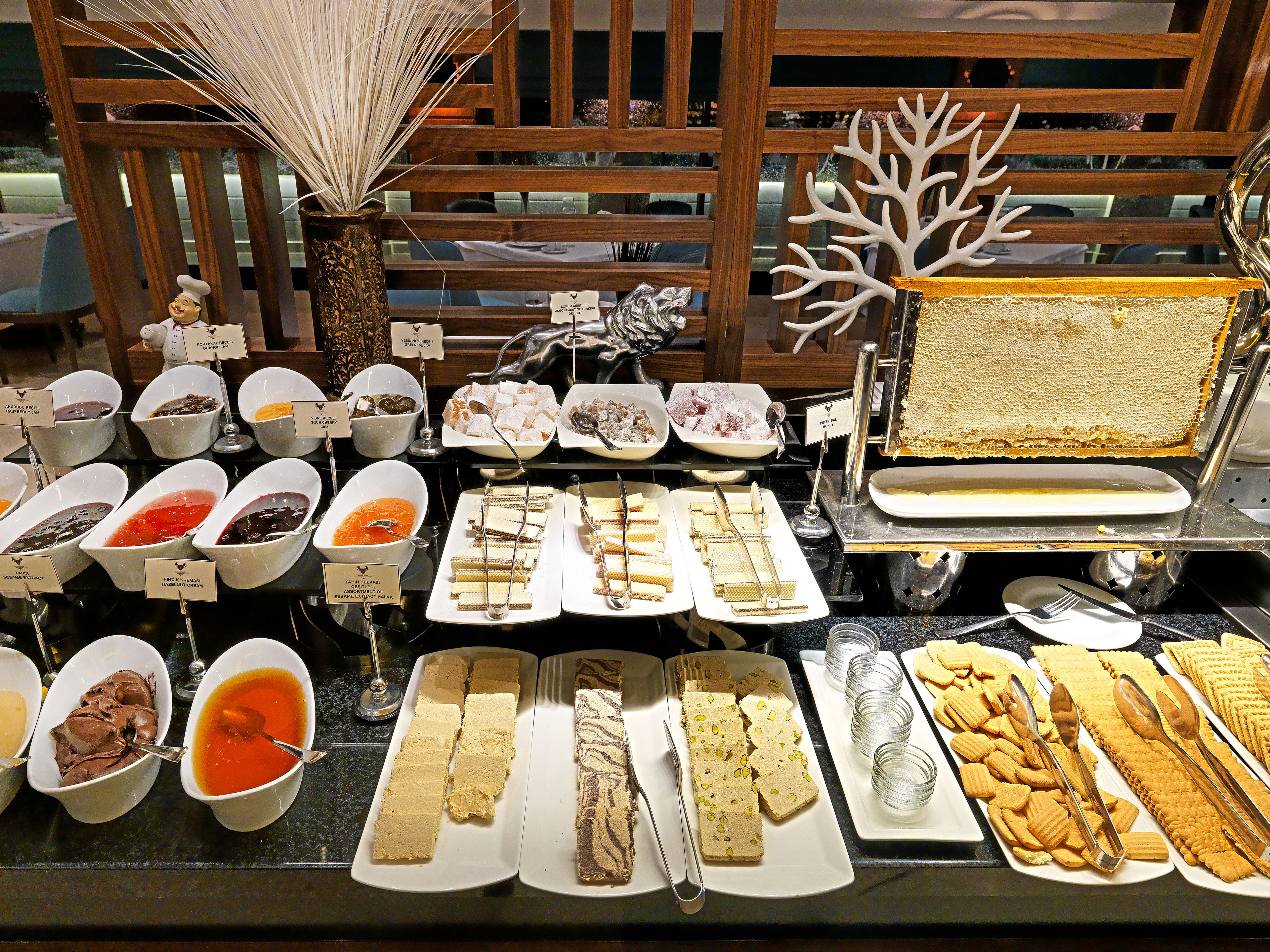 A buffet with various dishes and desserts.