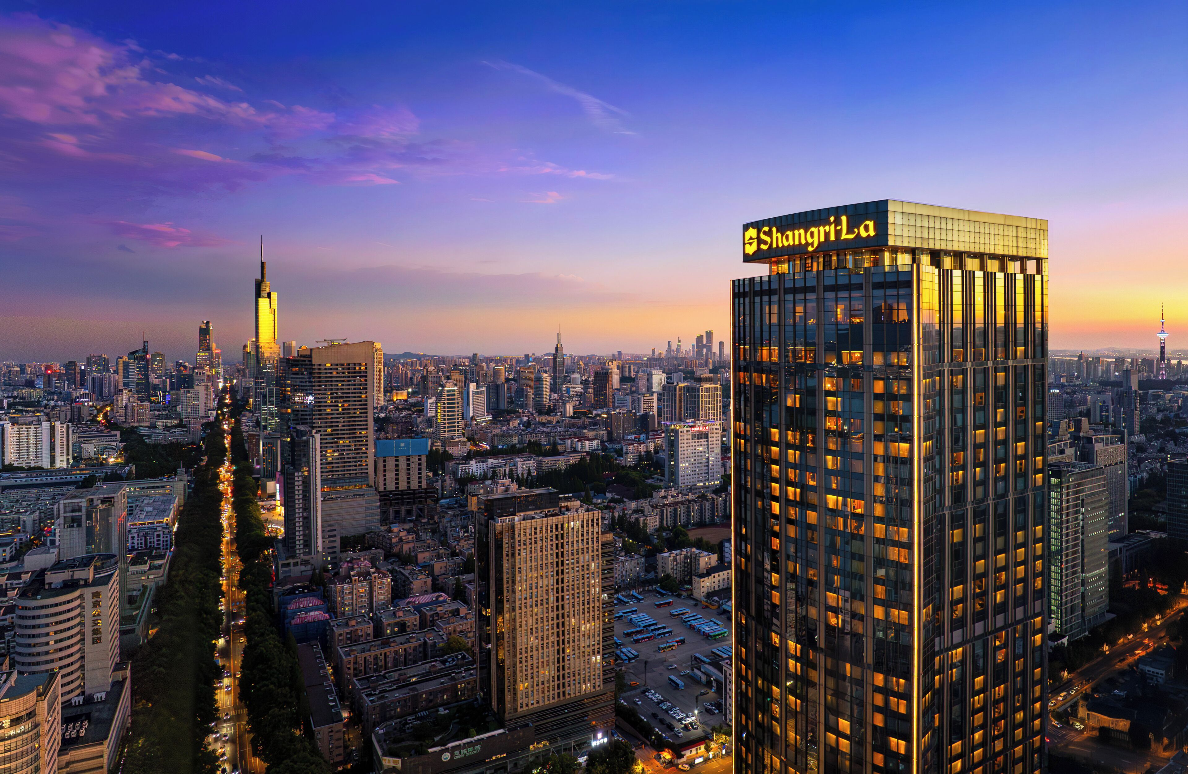 A high-rise building with a prominent sign reading "ShangriLa".