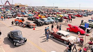 A crowded parking lot with various vintage cars and a Ferris wheel in the background. - Holiday Inn Express & Suites West Ocean City by IHG (Ocean City)