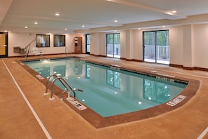 An indoor swimming pool with clear water, marked depth lines, and a no diving sign. - Holiday Inn Express & Suites West Ocean City by IHG (Ocean City)
