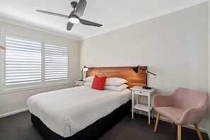 Three Bedroom Cottage | Desk, iron/ironing board, bed sheets - West End Motor Lodge (Orange)