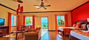 Suite Deluxe, 2 camas de matrimonio, vistas al mar | 1 dormitorio, ropa de cama de alta calidad, edredones de plumas