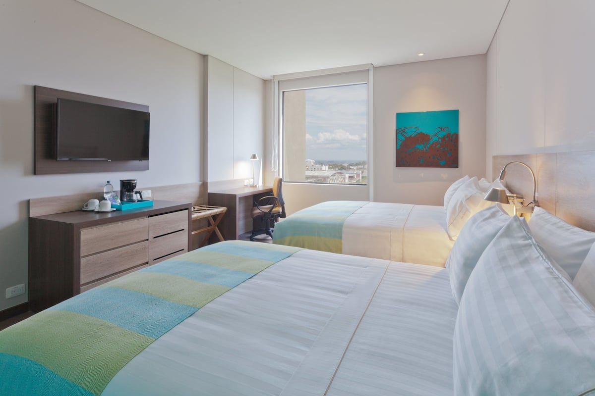 standard room, 2 double beds | minibar, in-room safe, desk, iron/ironing board