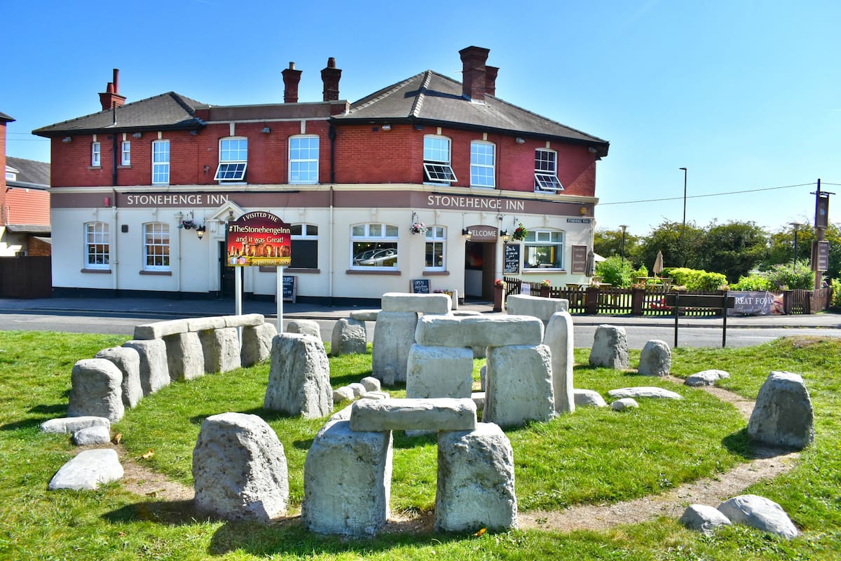 Stonehenge Inn with a stone circle in front.