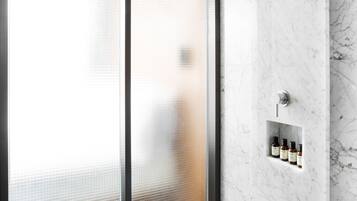 Shower, designer toiletries, hair dryer, slippers